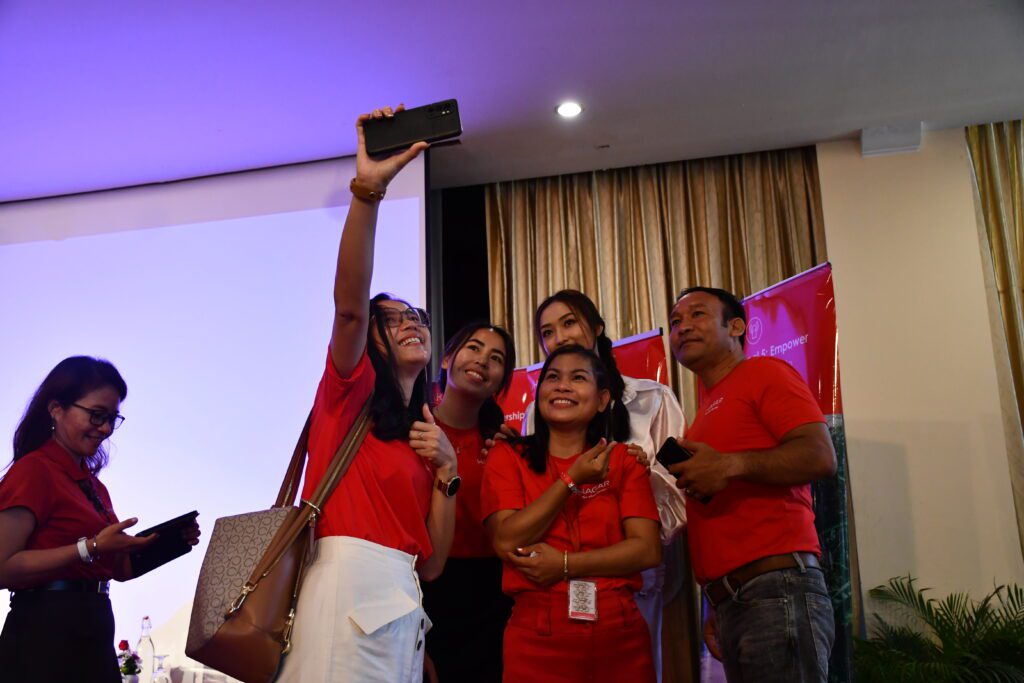 Former survivors pose for a selfie at Hagar Alumni Celebration